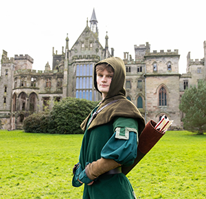 Image shows Robin Hood standing in front of the manor house at Alton Towers, Staffordshire